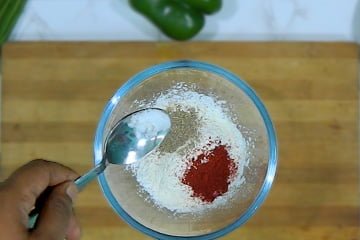 add salt red chilli powder black pepper powder in maida and cornflour mixture