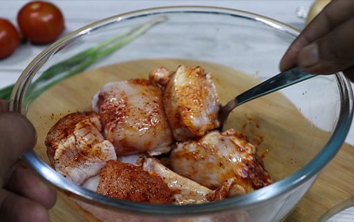first-marinate-chicken-with-spoon