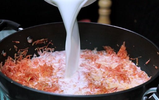 pour-milk-in-grated-carrot