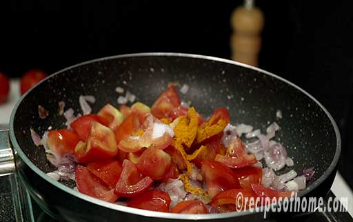 add tomato,sprinkle salt,turmeric