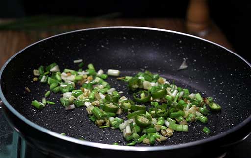 saute-chopped-spring-onion-and-green-chilli
