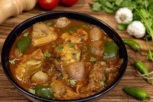 kadai chicken recipe kadai-chicken-recipe-in-black-serving-bowl