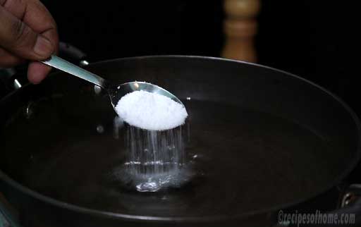 mix-salt-by-spoon-in-kadai