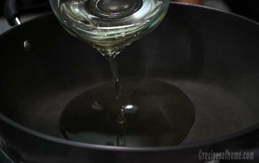 pour-melted-ghee-in-nonstick-kadai