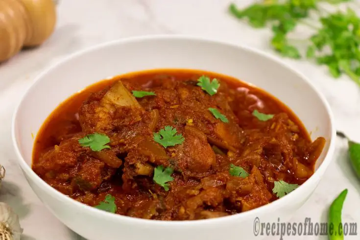 spicy chicken masala recipe serve on white serving bowl