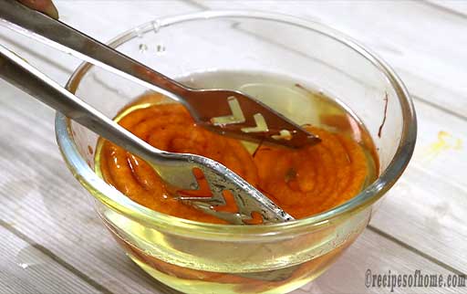 pour-jalebis-in-slightly-warm-sugar-syrup
