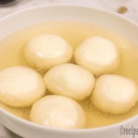 white-bengali-rasgulla-recipe-serving-on-white-bowl
