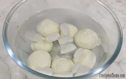 cool-rasgulla-in-icy-cold-sugar-syrup-to-retain-it's-shape