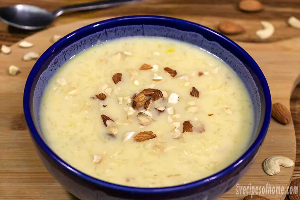 rice-kheer-recipe-sprinkle-with-chopped-dried-fruits-in-blue-ceramics-bowl