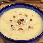 rice-kheer-recipe-sprinkle-with-chopped-dried-fruits-in-blue-ceramics-bowl