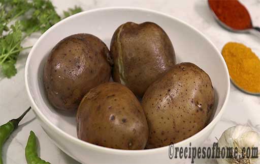 boil potatoes place on white bowl