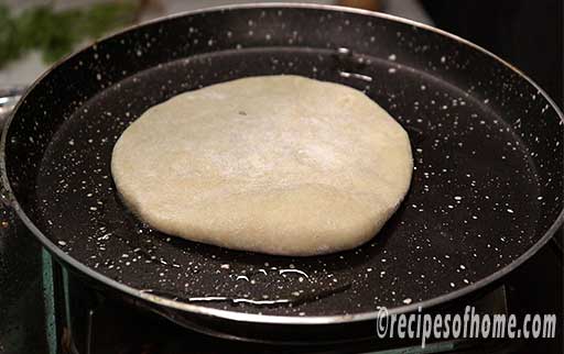 fry aloo paratha in a pan