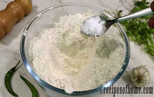 pour maida salt in mixing bowl