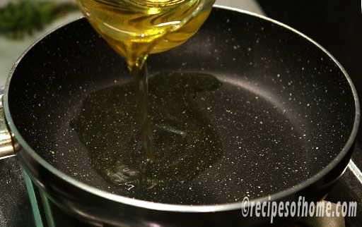 pour oil in a pan for frying tikki