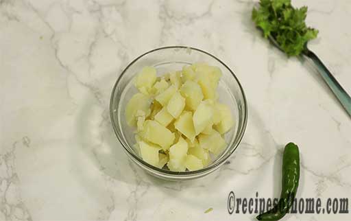 chopped boil potatoes in a glass bowl