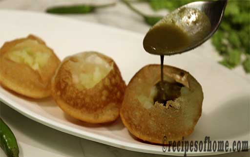 pour boil potatoes,green chutney on puri