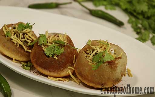 garnish with sev and chopped coriander leaves