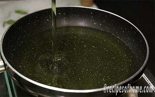 pour oil in a pan