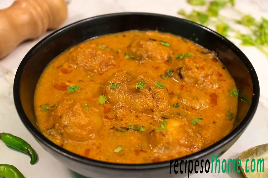 punjabi dum aloo recipe serving on black bowl