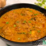 punjabi dum aloo recipe serving on black bowl