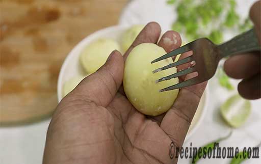 prick boil potato with fork