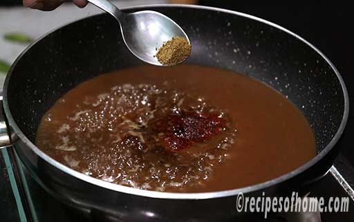 add water,tamarind mixture,spices in a pan