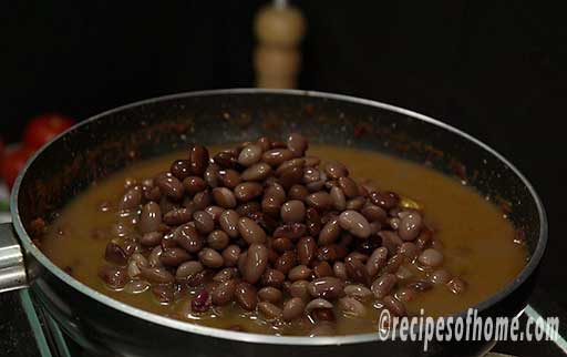 add boiled rajma bean and water