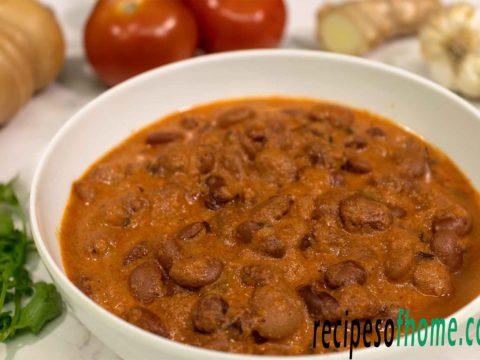 rajma masala garnished with a few kasuri methi and freshly chopped coriander leaves served in a white bowl