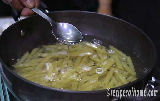 add penne pasta and dash of oil in it