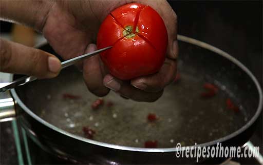 cut the tomatoes in cross shape