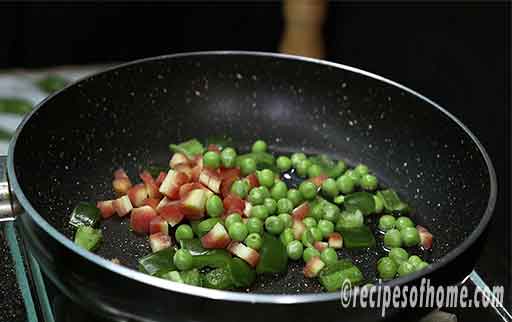 add chopped carrots,chopped capsicum,green peas in a pan