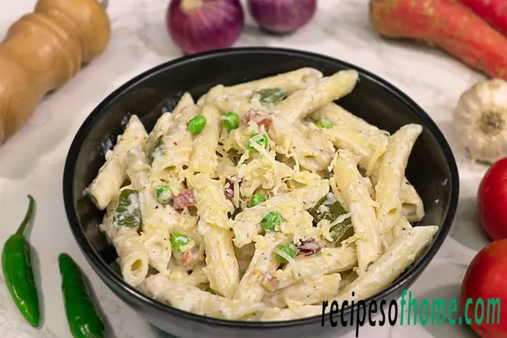 white sauce pasta garnish with grated cheese 