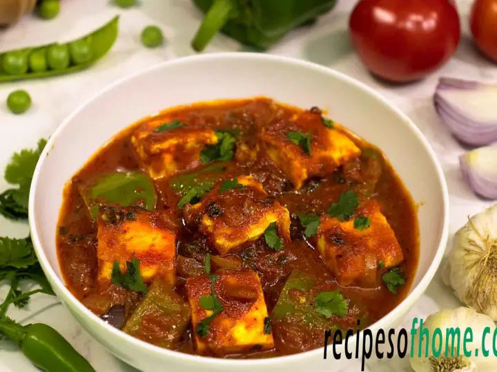 kadai paneer recipe serve in white bowl garnish with fresh coriander leaves