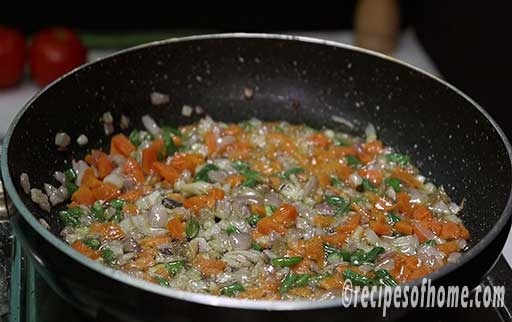 add chopped carrots,french beans,capsicum,onions,green chili