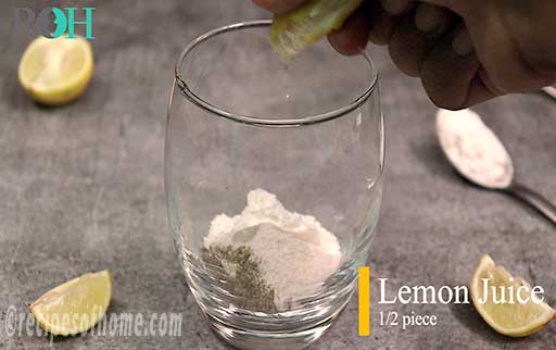 squeeze lemon juice in glass