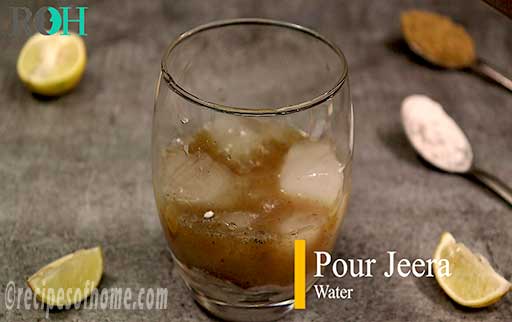 pour half glass jeera water in glass