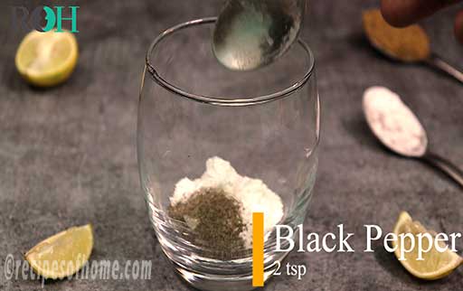 sprinkle black pepper in glass