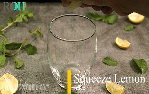 squeeze lemon juice in a glass