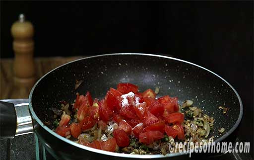 add chopped tomatoes and pinch of salt