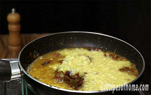 pour mashed dal in pan