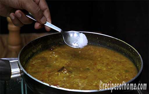 sprinkle salt and cook dal till it thickens