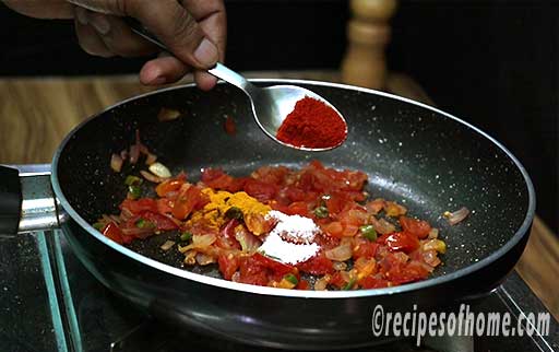 add garam masala powder , red chili powder , turmeric powder , salt