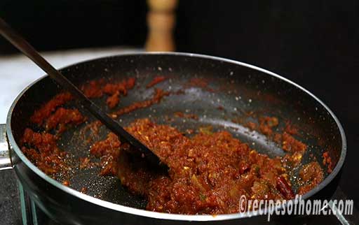 cook this tomato onion mixture till oil release side of the pan