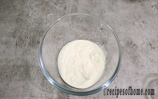 pour sour curd in a mixing bowl