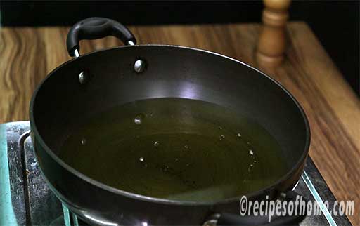 pour oil in a kadai