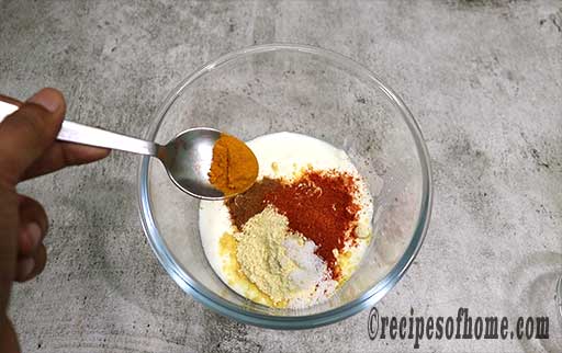 sprinkle salt, turmeric, besan, red chili powder , garam masala powder