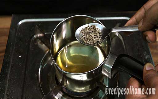 pour ghee and cumin seed in a tadka pan