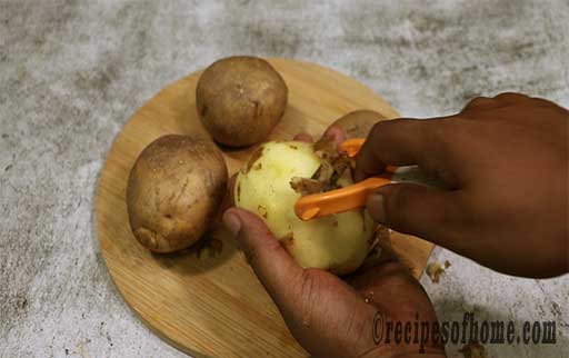 wash and peel potatoes with peeler