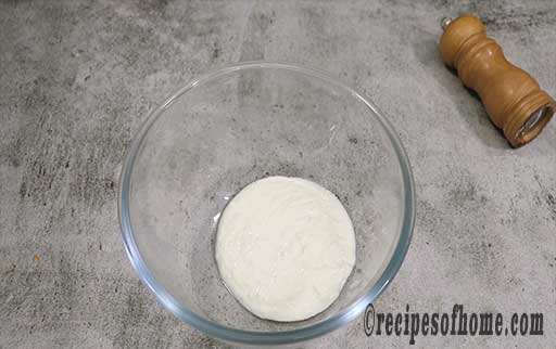 pour curd in a bowl and whisk properly