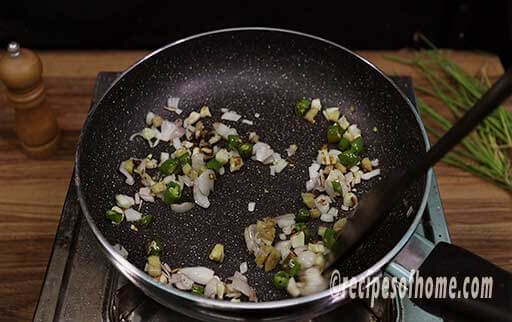 cooked chopped onions and green chili